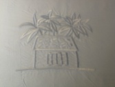 The hotel's logo is embroidered on some of the linen.
